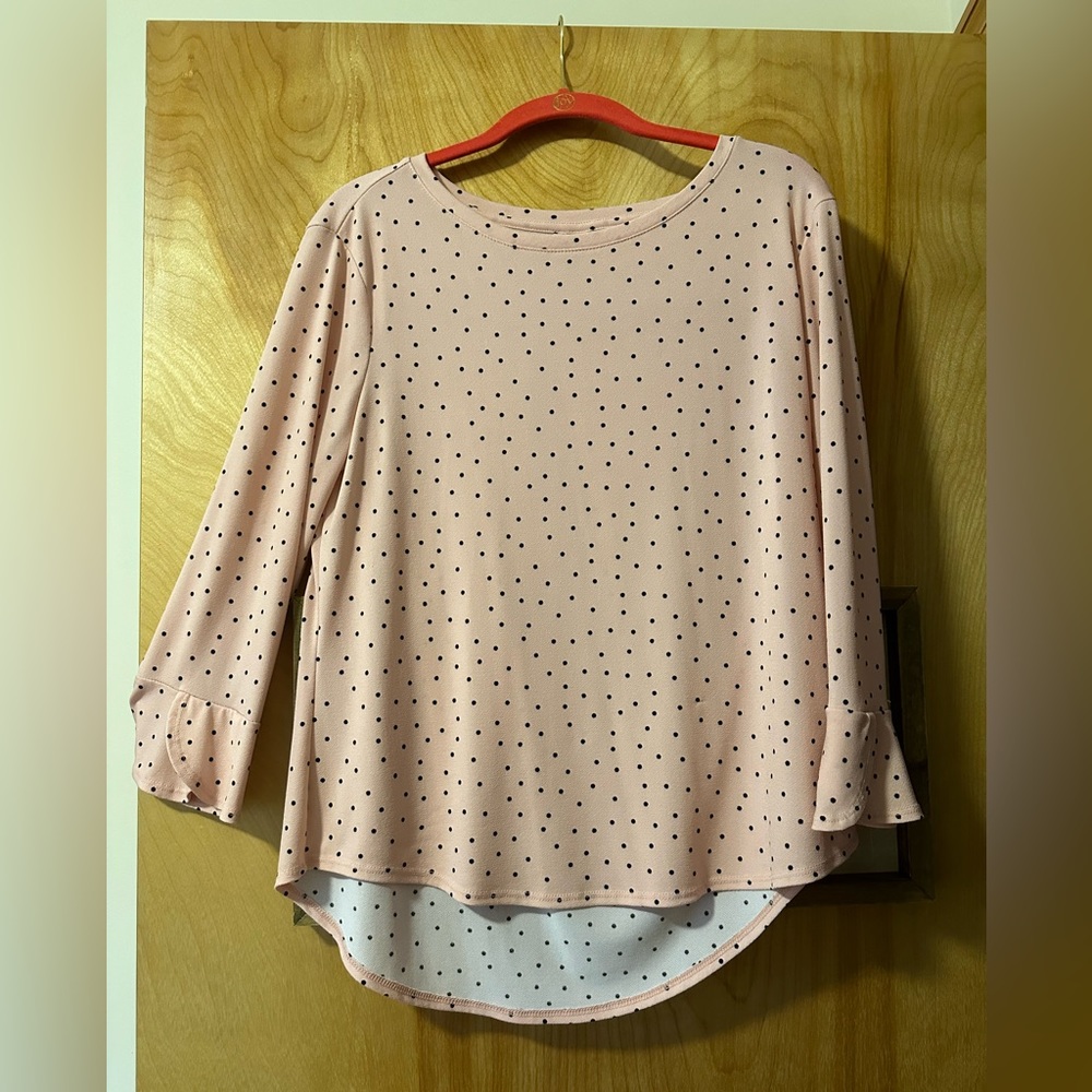 Elle 95% polyester 5% spandex rose colored blouse with black dots.